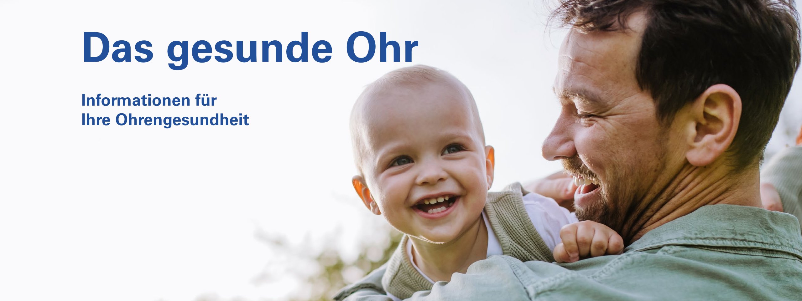 Das gesunde Ohr – Informationen für Ihre Ohrengesundheit. Lachender Vater mit Baby auf dem Arm